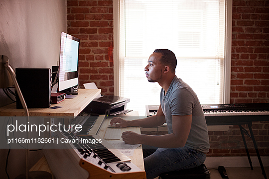 Man using desktop computer at home