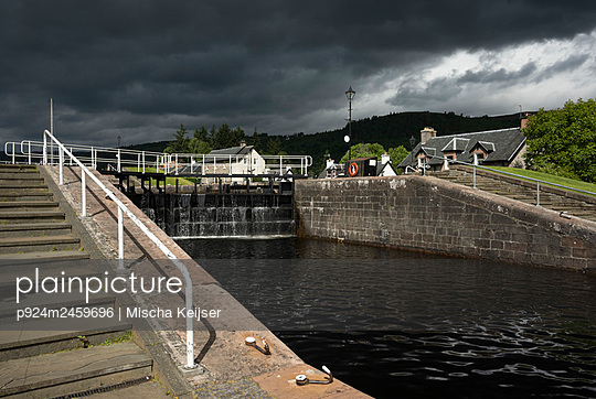 UK, Scotland, Storm clouds over canal lock - p924m2459696 by Mischa Keijser